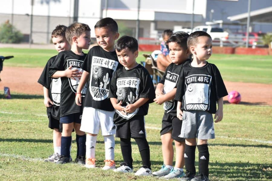 group of soccer kids playing in an Arizona youth soccer club